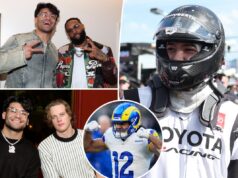 Puka Nacua sentado na quadra durante um jogo de basquete masculino da BYU