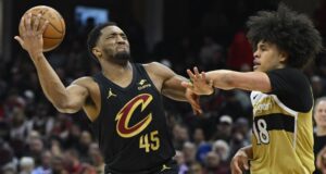 Donovan Mitchell, jogo do Cavs contra clique na rede de Young.