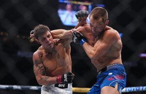 Caio Borralho grita com Dricus Du Plessis após vitória no UFC 326