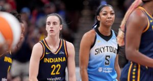 Caitlin Clark ignora o cumprimento de Angel Reese durante um jogo da equipe dos EUA.