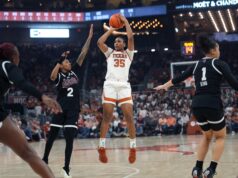 A jogada de Madison Booker pune um defensor muito disputado