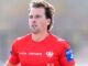 O lateral direito do St George Illawarra, Clint Gutherson, responde à perseguição da estrela do North Queensland Cowboys, Scott Drinkwater.