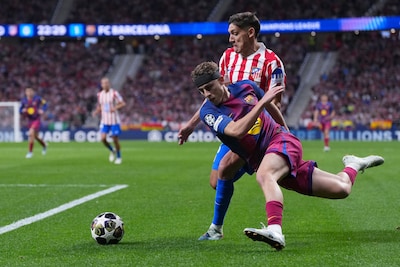 barcelona-s-fermin-lopez-front-and-atletico-madrid-s-nahuel-molina-challenge-for-the-ball-during-the.jpeg
