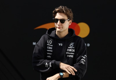 epa12852971-mercedes-driver-george-russell-of-britain-walks-through-the-paddock-ahead-of-the-free-pr.jpeg