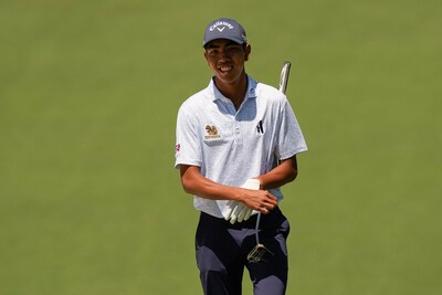 fifa-laopakdee-of-thailand-walks-to-green-on-the-second-hole-during-the-first-round-of-the-masters-g.jpeg