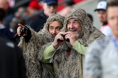 southampton-england-may-12-mocking-southampton-fans-in-camouflage-ghillie-suits-after-their-side-was.jpeg