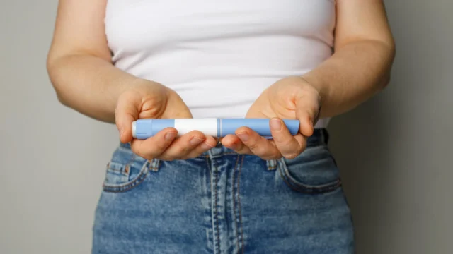 woman-holding-semaglutide-ozempic-weight-loss-diabetes-pen.webp.webp