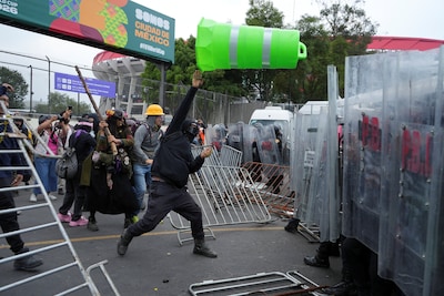demonstrators-clash-with-police-officers-during-a-protest-on-the-day-of-the-opening-match-of-the-202.jpeg