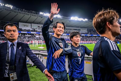 japans-ayase-ueda-2l-and-yuki-soma-2r-wave-to-fans-as-they-celebrate-their-team-s-victory-at-the-end.jpeg