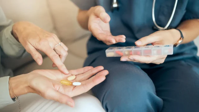 senior-woman-nurse-nutritionist-comparing-medications-vitamins-and-supplements.webp.webp