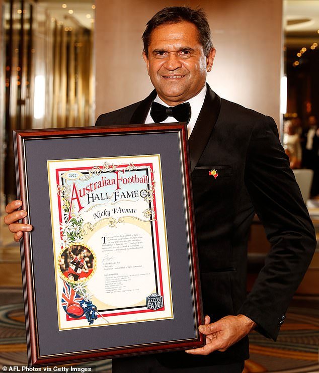 105650927-15479075-Nicky_Winmar_is_pictured_during_his_induction_into_the_Australia-a-1_178304719685.jpeg