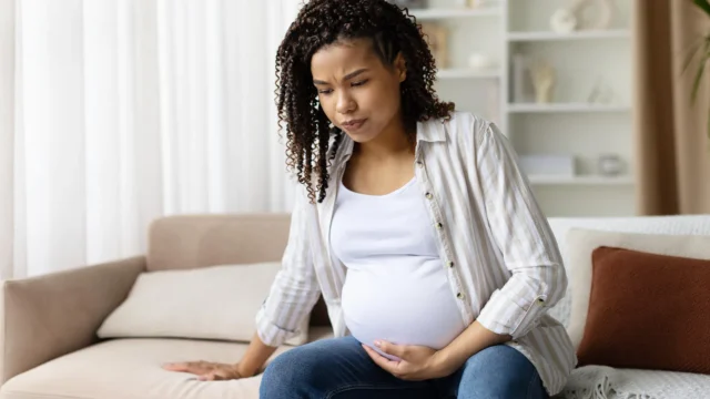 concerned-pregnant-woman-holding-belly.webp.webp