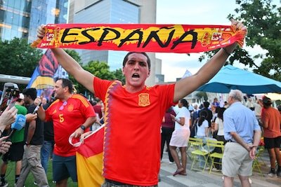 epa13109703-a-supporter-of-spain-cheers-as-supporters-of-france-gather-at-a-rally-in-dallas-texas-us.jpeg