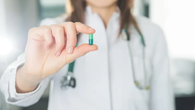 female-doctor-holding-new-medicine.webp.webp
