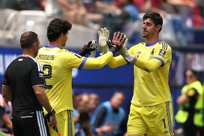 inglewood-california-july-10-thibaut-courtois-1-of-belgium-high-fives-senne-lammens-12-after-being-s.jpeg