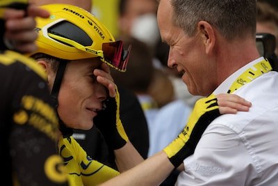 jumbo-visma-s-danish-rider-jonas-vingegaard-wearing-the-overall-leader-s-yellow-jersey-celebrates-vi.jpeg