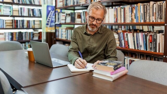 man-studying-library.jpg