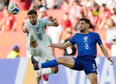 portugal-s-bruno-fernandes-8-battles-with-croatia-s-mateo-kovacic-8-during-the-world-cup-round-of-32.jpeg
