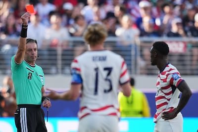 referee-raphael-claus-of-brazil-shows-a-red-card-to-united-states-folarin-balogun-right-during-the-w.jpeg