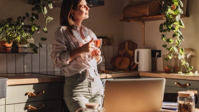 young-happy-woman-drinking-coffee-1093748061_64fbb9.jpg