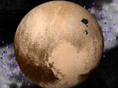 A perda do status planetário de Plutão pode ser a melhor coisa que já aconteceu à diversidade do sistema solar A planet with red patches and cream patches against a dark background.
