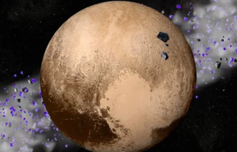 A perda do status planetário de Plutão pode ser a melhor coisa que já aconteceu à diversidade do sistema solar A planet with red patches and cream patches against a dark background.